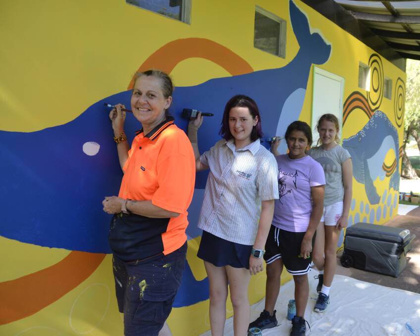 A mural with 'aboriginal flavour': Artist Lea Taylor with youth painters Kayla Turner, Marcisha Dennison and Katie Hall. Picture: Pip Waller 