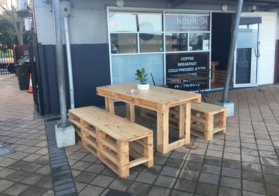 Exterior of Nourish Juice and Coffee Bar featuring the custom-designed and built furniture. Photo is supplied.