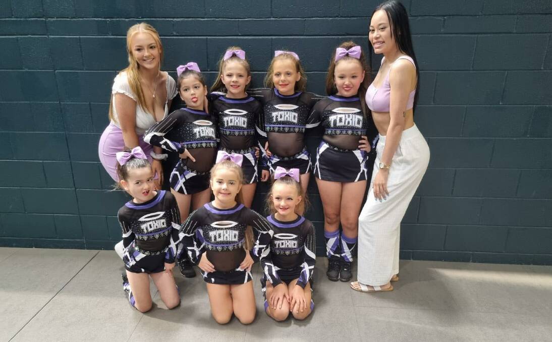 Tiaras (mini's level one) with their coaches Lottie and Kelea. The team placed first. Photo is supplied.