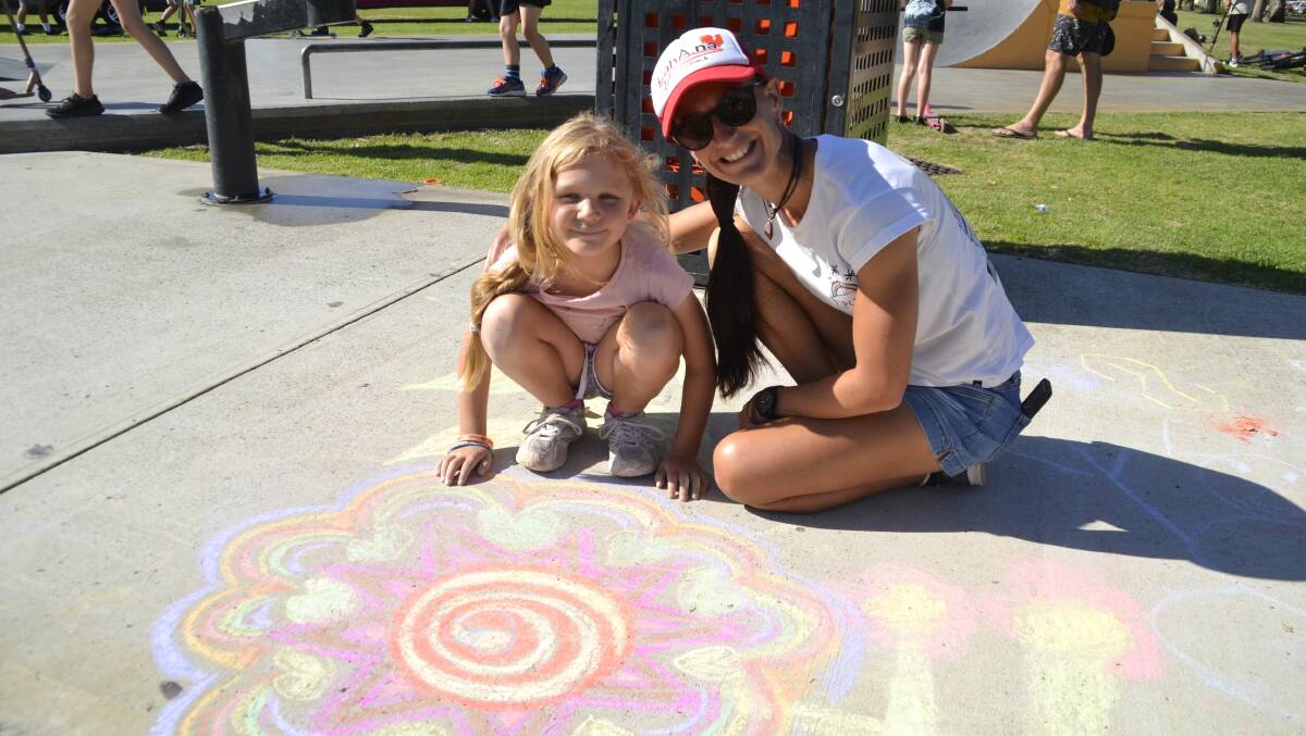 Jade and Penny Wilson with their flower chalk design. Picture: Pip Waller 