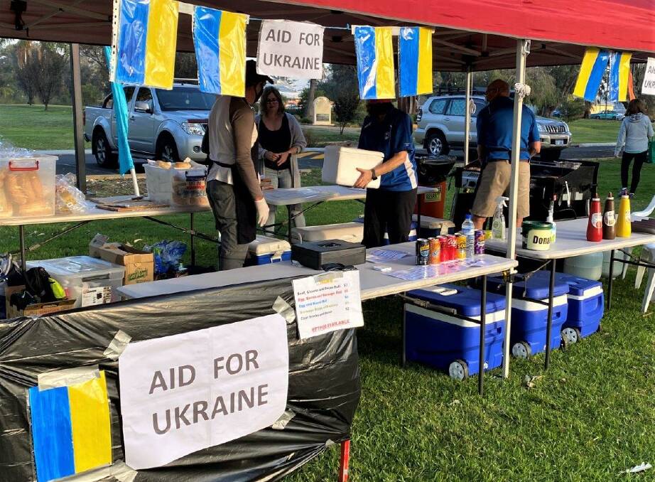 Campbell's wife, Viv, decorated Forza's stall with Ukrainian flags to help advertise the fundraiser. Picture: Supplied