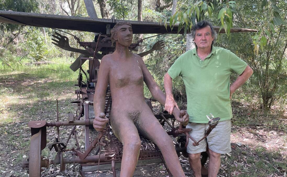 Dozens of sculptures: Mr Sheridan pictured with one of his favourite pieces. Picture: Pip Waller 