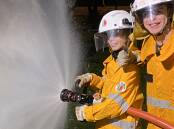 Part of the team: Cadets Jaxon Hawkins and Lucas Ransley using a fire hose as part of their training. Picture: Supplied