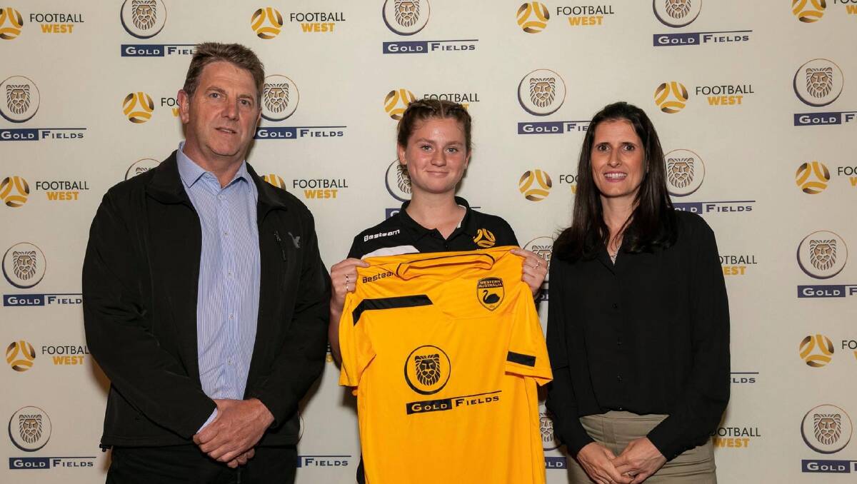 Lucy Hope receiving her jersey for the 2021 Goldfields State Tournament, under 16s team. Photo is supplied. 