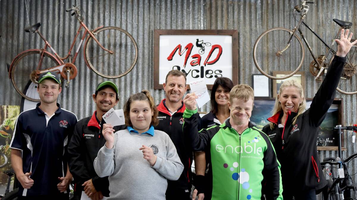 Amelia Hutchins, Elliot Mason and the team at Mad Cycles Bunbury. Photo supplied by Moshi Moshi Marketing. 