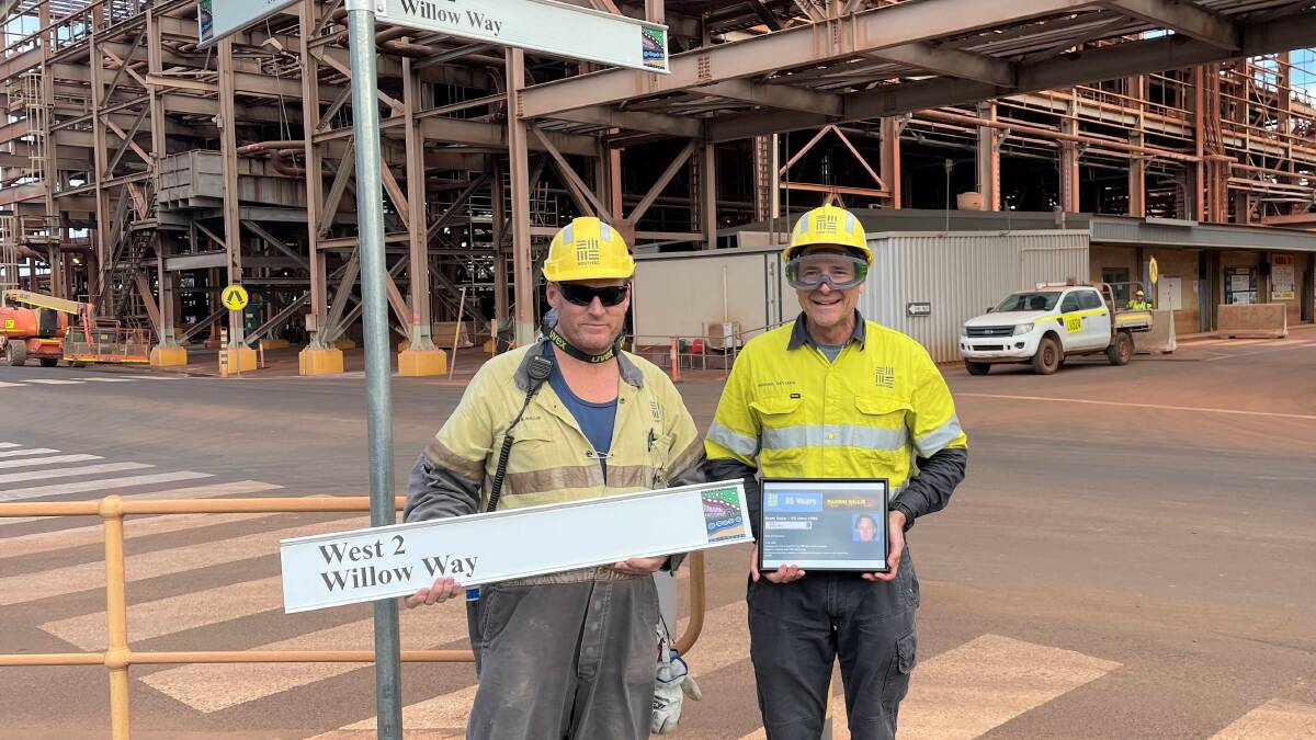 COMMEMORATION: Worsley Alumina Refinery Process Operator Darren Willis (left), from Dalyellup, and Manager Bayer Production Michael De Viana, on the corner of Willow Way and Millers Meander. Picture: Supplied.