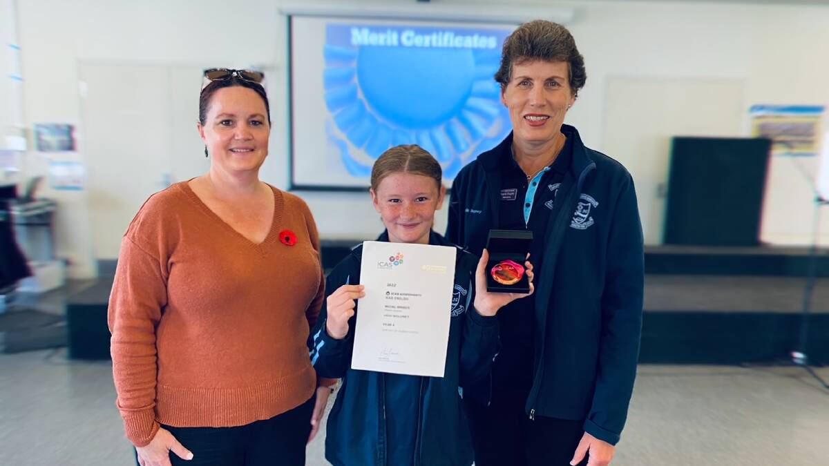 Assistant Principal Paula Houston and Principal Angela Hegney presented the medal to Heidi at a whole school assembly. Picture supplied.