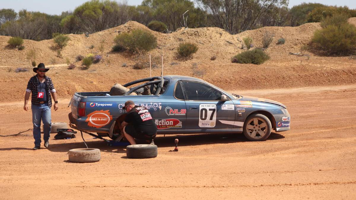 Holden' on - A bit of bush mechanics before hitting the road again. Picture via Dirt n Dust Run.