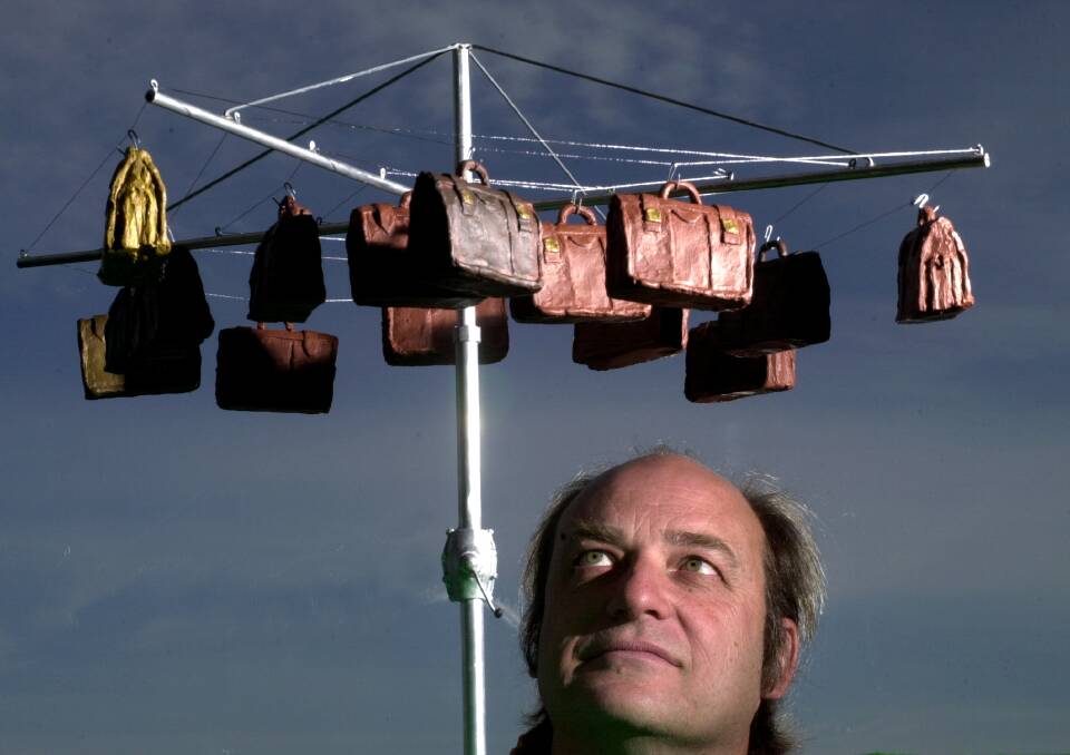 Artist Michael Partridge with his Hills Hoist sculpture in 2002. Picture by Andrew Campbell