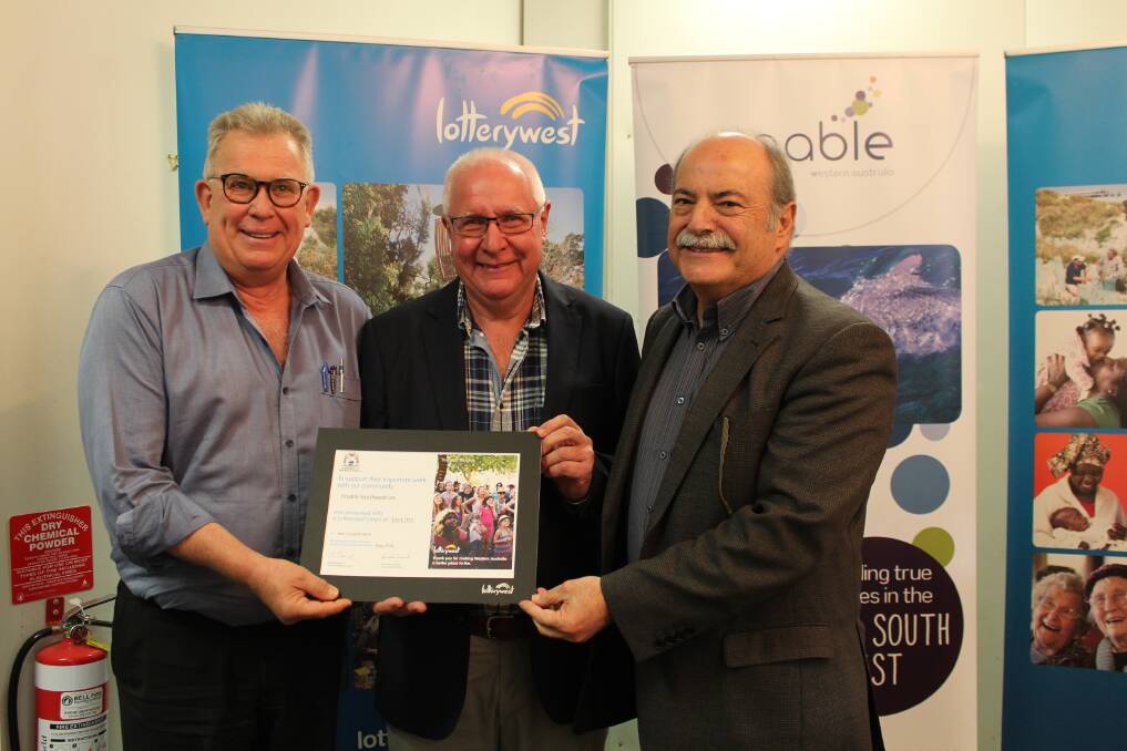 Enable board chairman Roger Veen, Lotterywest board member Garry Trinder and Bunbury MLA John Castrilli celebrate Enable receiving a $300,000 grant to expand its services.
