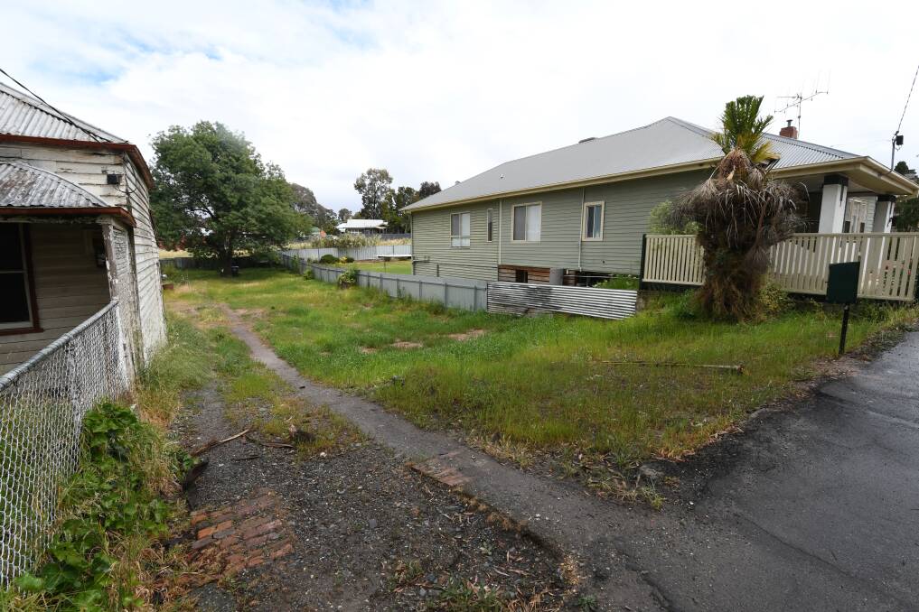 The site where the house used to be, now a vacant lot. Picture: NONI HYETT