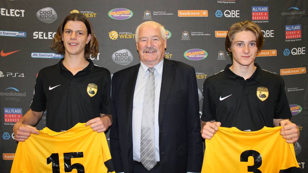 Bunbury soccer players Ben Steele and Charlie Betts receiveing their WA state playing shirts from Minister for Sport and Recreation Mick Murray.