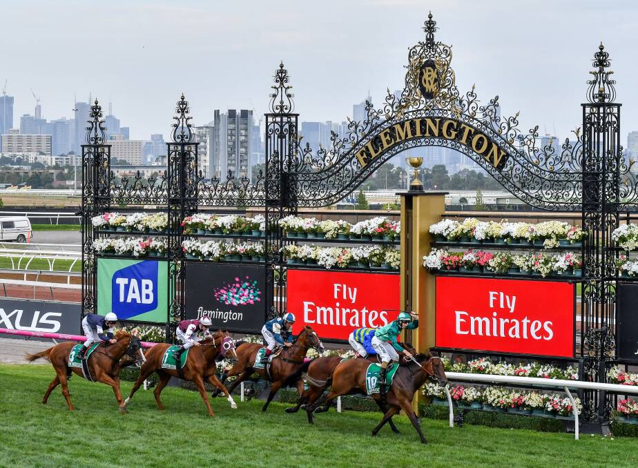Saluting: Bunbury raised jockey Damian Lane partnered with Humidor to win Saturday's Group One Australian Cup at Flemington in Melbourne. Photos: Getty Images. 