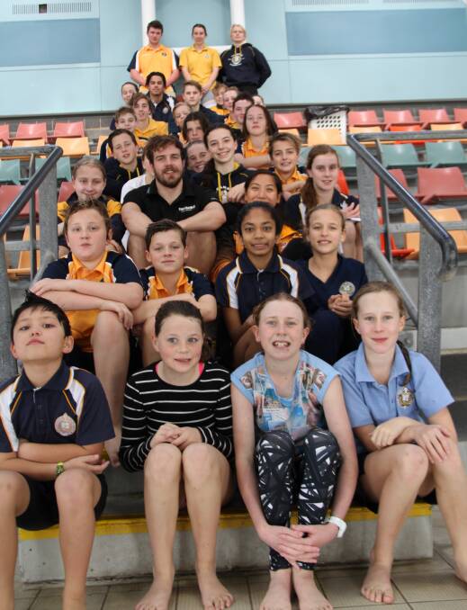 National swimmers Heidi Gan and Ryan Evernden visited Bunbury on Saturday to help improve the skills of the Bunbury Cathedral Grammar School swimming students. 