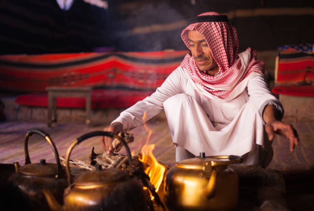 A Bedouin man prepares traditional Jordan tea on fire in Wadi Rum. Picture: Shutterstock