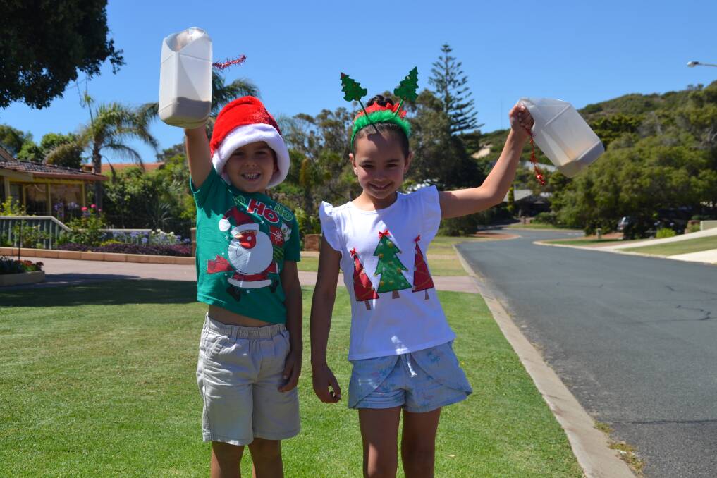 Christmas cheer: Dunstan Street locals Sonny and Stella Dean are eagerly anticipating the annual lantern event and street party, held from December 22 and 24. Photo: Thomas Munday. 