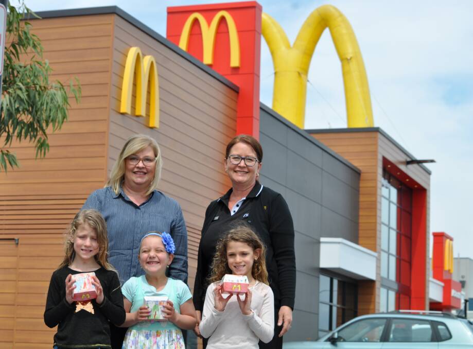 Art lovers: McDonalds Dalyellup licensee Trina Eagles and McDonalds HR manager Laura Lange alongside artists Eden Turner, Lilliana Scallan and Willow Turner. Photo: Thomas Munday. 