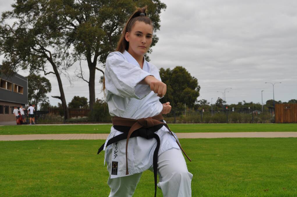 Dedication and discipline: Karate black-belt Olivia Morgan is honing her skills ahead of the upcoming national and state championship events. Photo: Thomas Munday. 