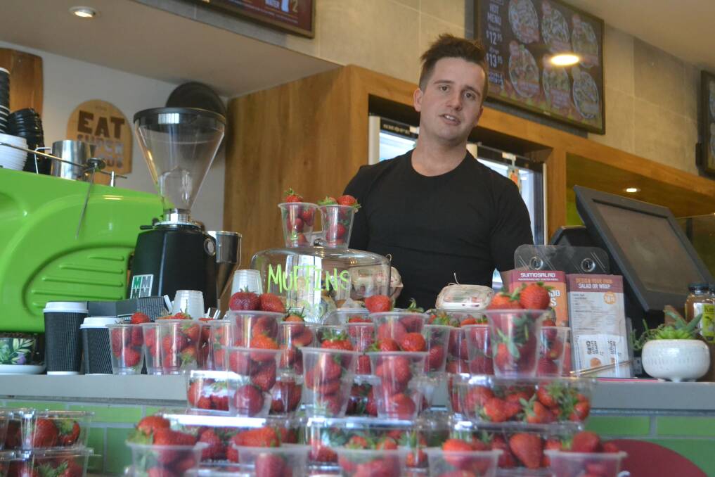 Lending a hand: Sumo Salad, Bunbury owner Daniel McNish and his employees have launched a new campaign to sell strawberries to help those in the strawberry industry. Photo: Thomas Munday. 