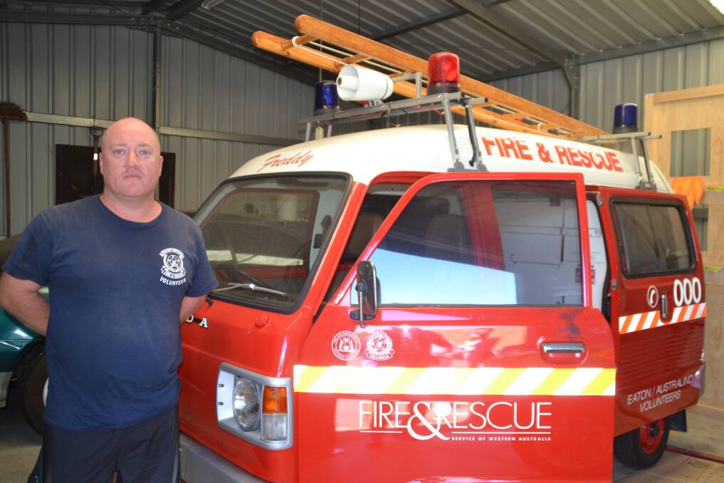 Station struck: Eaton Australind Volunteer Fire and Rescue Service Captain Richard Constantine next to Freddy the Fire Engine. Two vehicles housed in the station's shed were broken into on Tuesday. Photo: Thomas Munday. 