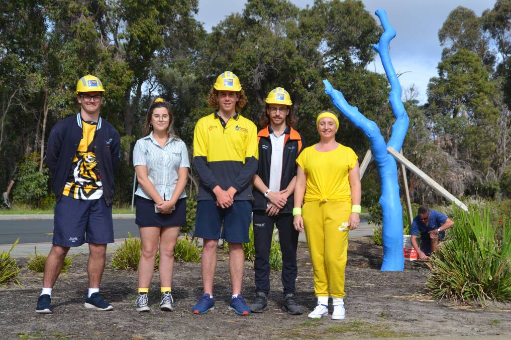 Helping hands: Dalyellup College Year 12 students Grantly Deer, Phoebe Scott, Carter Matthews, and Jarrod Smith with health and phys ed teacher Jenaya Bell. Photo: Thomas Munday. 