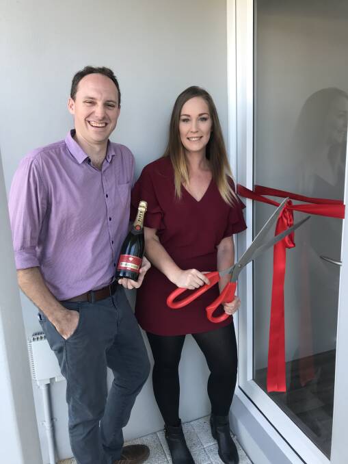 Celebrations: New Homes Consultant Dale Huntington signed Shaye Brewer to her first home. Photo: Supplied. 