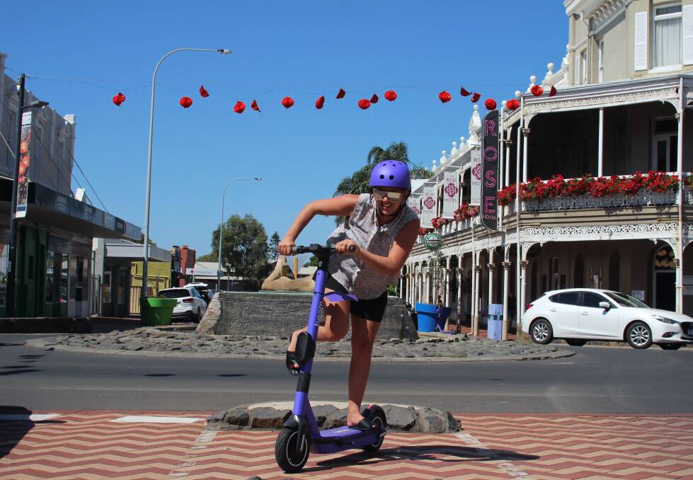 Rebecca Neil takes the brand new e-scooter for a spin. Photo: Jesinta Burton.