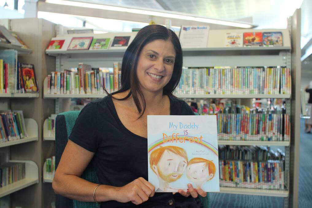 Author Suzi Faed with a copy of her latest book My Daddy is Different. Photo: Jesinta Burton. 