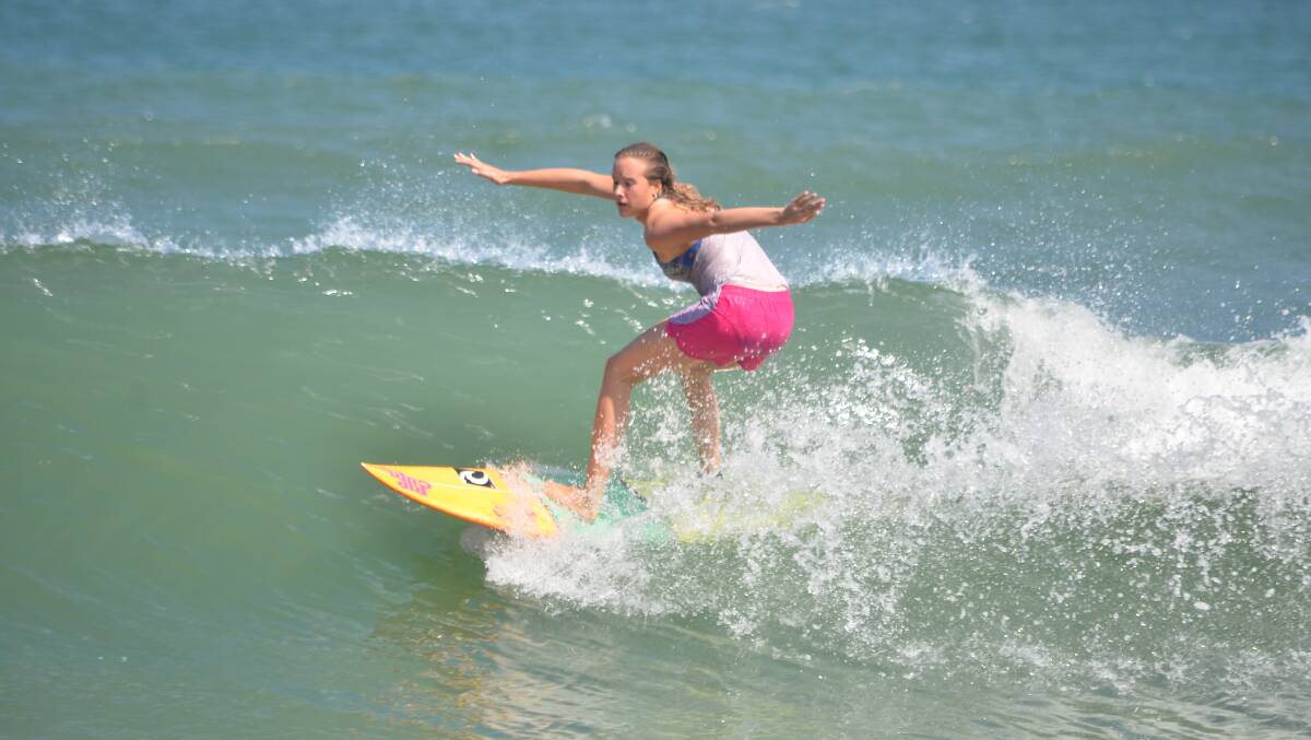 In the surf: Laeticia Brouwer remains steady and focused as she rides a wave. Photo: Julie Brouwer.