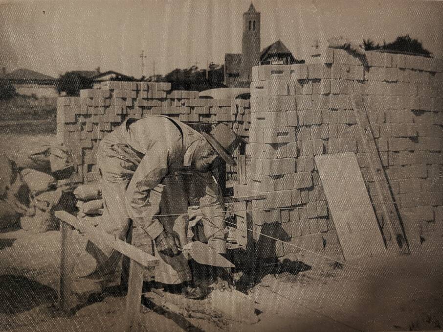 Claire Turfrey's great-grandfather Vivian Stammers, in the 1950s, building the Cooee Memorial Hall. 