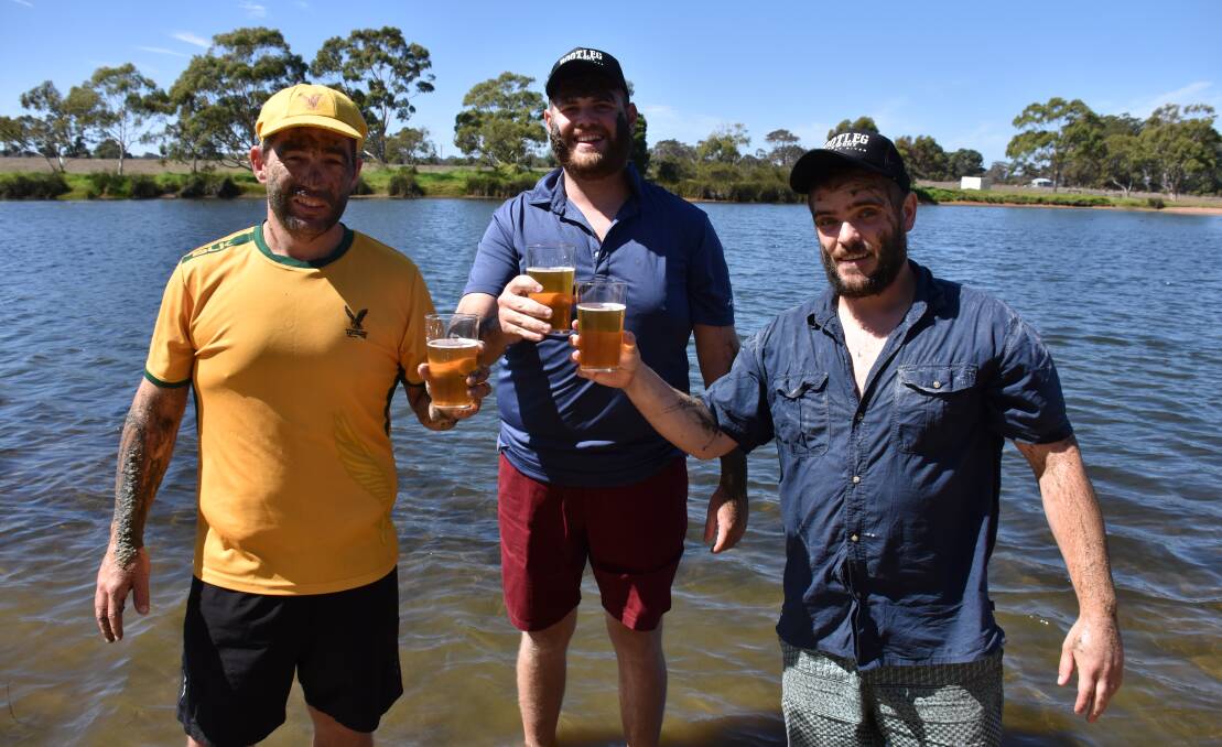 Margaret River Hawks Cricket Club member Micheal Earl, South West Mudfest event manager Jack Rogers, Bootleg Brewery brewer Dave Phillips. Photo by Emma Kirk.