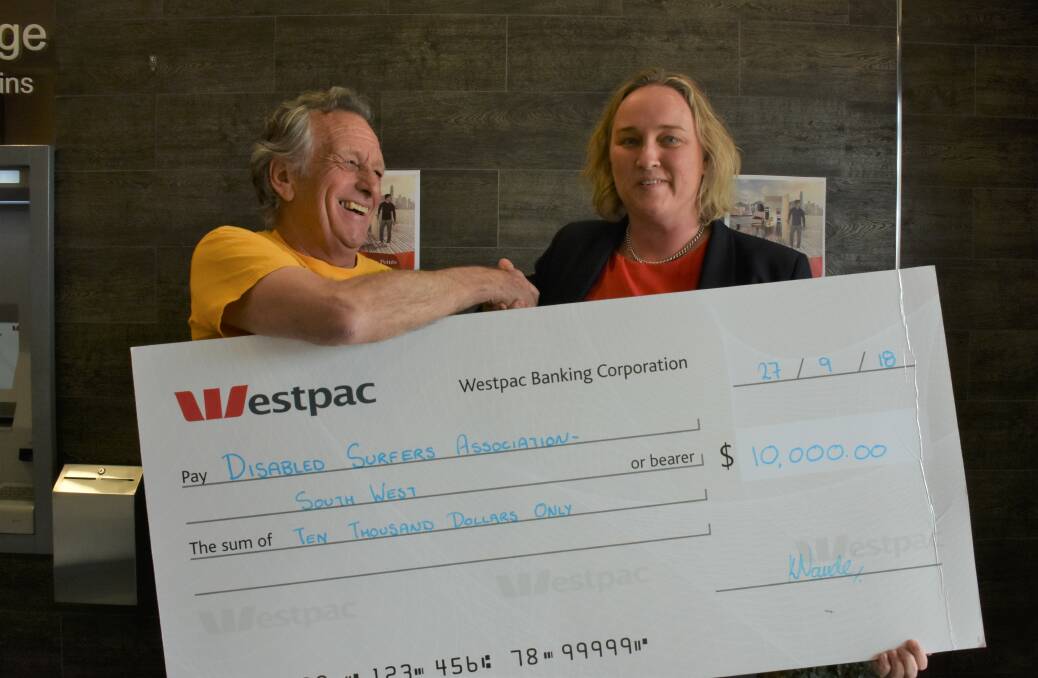 Disabled Surfers Association president Ant Pursell and Westpac Dunsborough branch manager Kirsten Naude.
