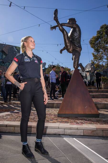 PIVOTAL: Tayla Harris attends her sculpture unveiling, branded "more than a kick", at Federation Square on Wednesday. Harris hopes this moment is remembered as a catalyst for change. Picture: Getty Images
