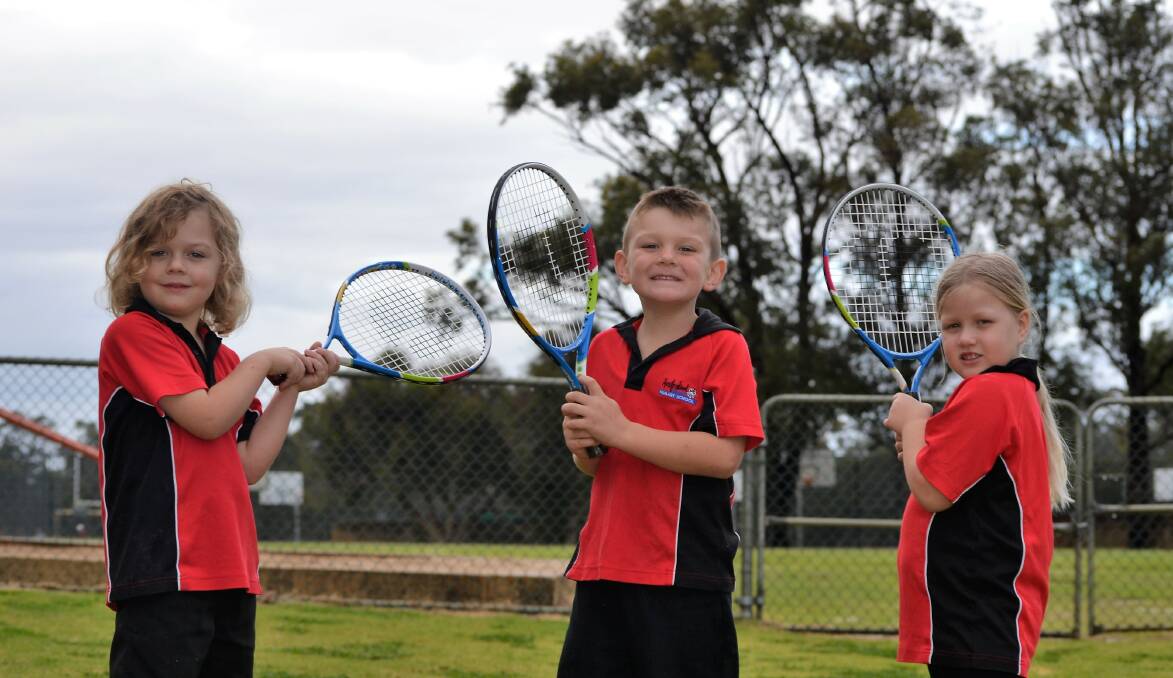 Tennis hot shots: Australind Primary School pre-primary students Elliot Steele, Marcus Street and Olivea Lund. Photo: Emily Sharp.
