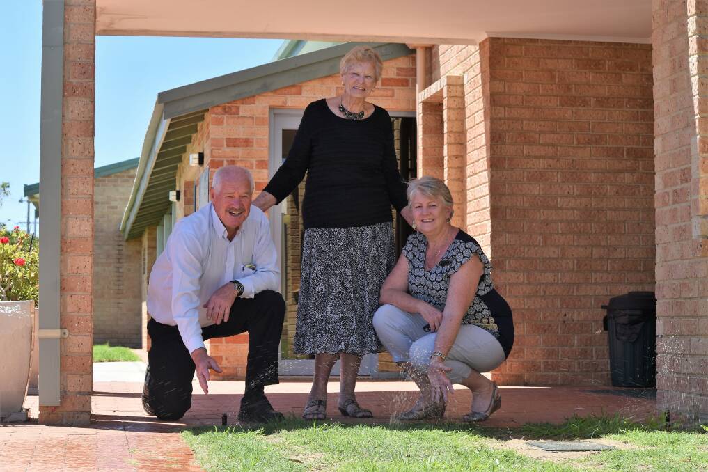 Member for Collie-Preston Mick Murray with Australind Senior Citizen Club president Elvaan Cole and Shire of Harvey president Tania Jackson inspect the new sprinklers. 