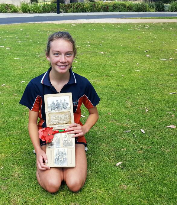 Remembering 100 years: Dalyellup College Year 9 student Asha Daley proudly holds her great great grandfather's photographs. Image supplied. 

