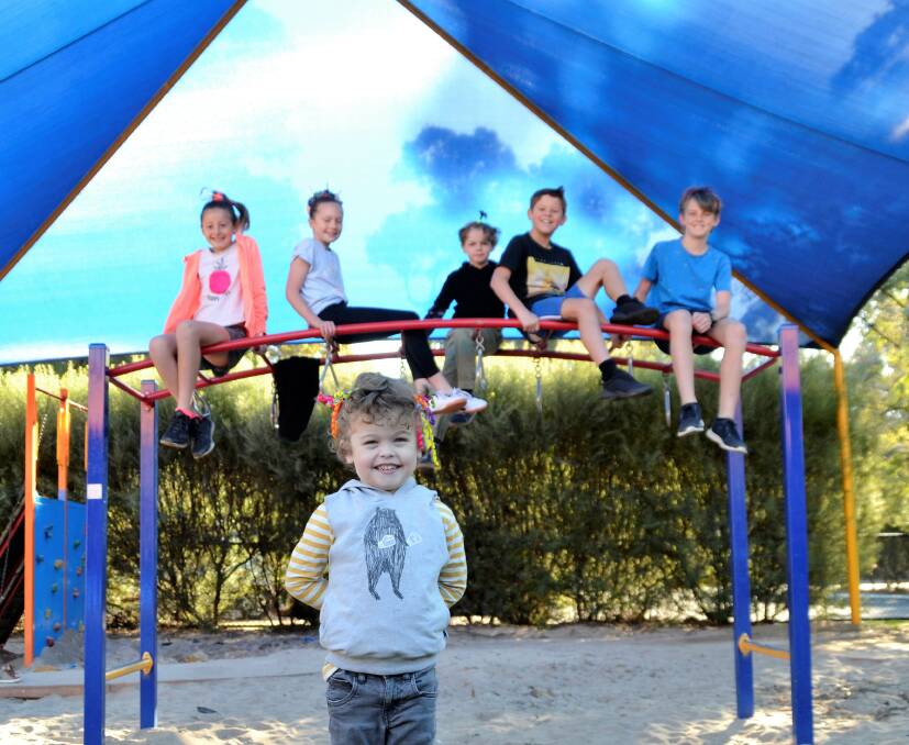 Supporting Conquer Cystic Fibrosis: Connor Barrett, 3, with Bunbury Cathedral Grammar School students. Photo: Emily Sharp. 