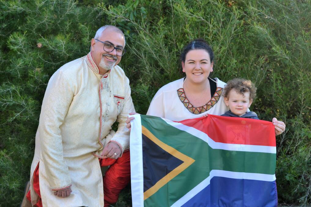Multicultural feast: St Augustine Uniting Church minister Greg Ross with community member Jodie Montgomery and her daughter Hannah, 1. Photo: Emily Sharp 