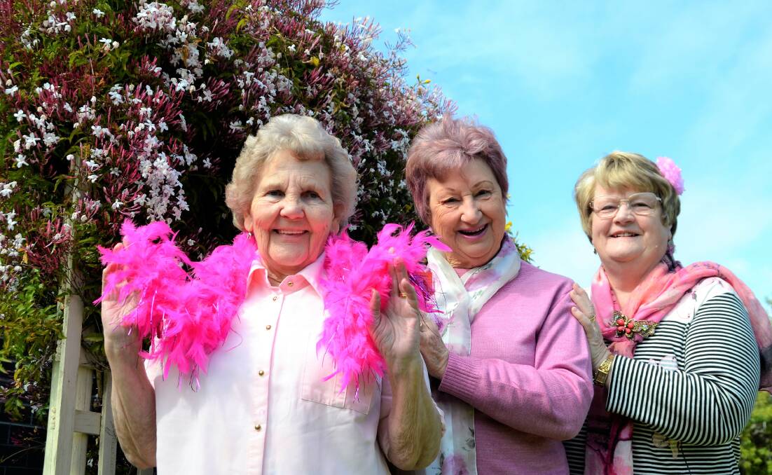 Turning pink: Golden Oldies members Doreen Harris, Heather Scott and Rae Taylor. Photo: Emily Sharp. 