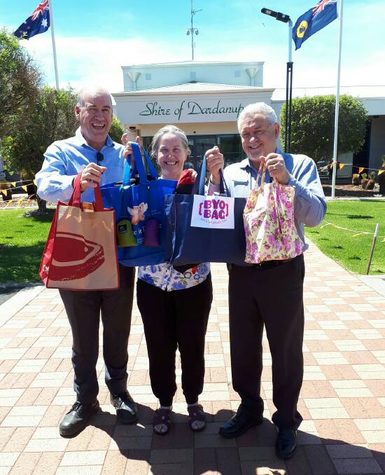 Shire of Dardanup environment officer James Kain, Councillor Carmel Boyce and chief executive Mark Chester embracing the BYO Bag campaign message.
