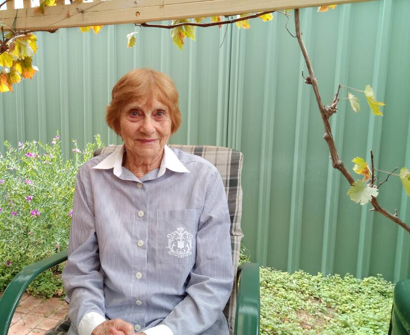South West resident Heather Burking enjoying her garden after recovering from a stroke. Image supplied. 