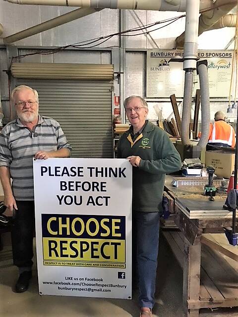 Bunbury Men’s Shed Eddie Forrest and Jeff Hookham show of their handy work to create a portable stand for the Choose Respect signage.