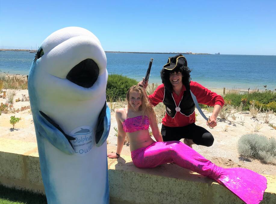 Showcasing Bunbury: Louie the dolphin along with volunteers Rebecca Dawson from the UK and Nico Wuesten from Germany are looking forward to the weekend.