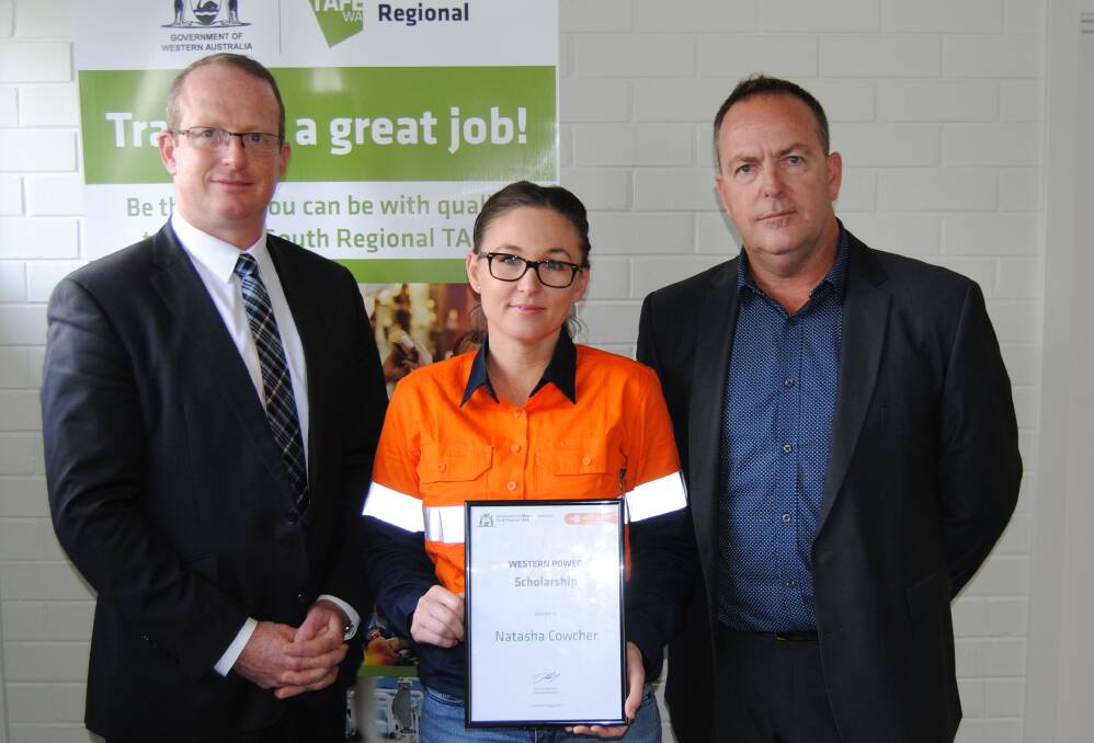 South Regional TAFE managing director Duncan Anderson with a recipient from last years scholarships Natasha Cowcher and David McMillan from Western Power.