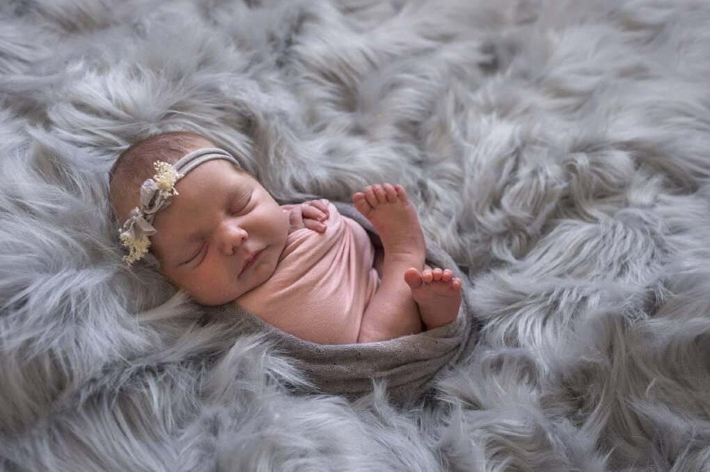 Sailor Grace Hart was born on April 6, 2018 at 8.43am to parents Shari Moore and Josh Hart and sisters Hazel-Leigh Hart, 4, and Ella-Jaide Hart, 3. Image by HM Butler Photography. 