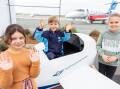 Winners:Iona, James and Millie chose the winning name 'Ningaloo' for the Royal Flying Doctor Service's newest jet in a name-the-plane competition. Pictures: Supplied.