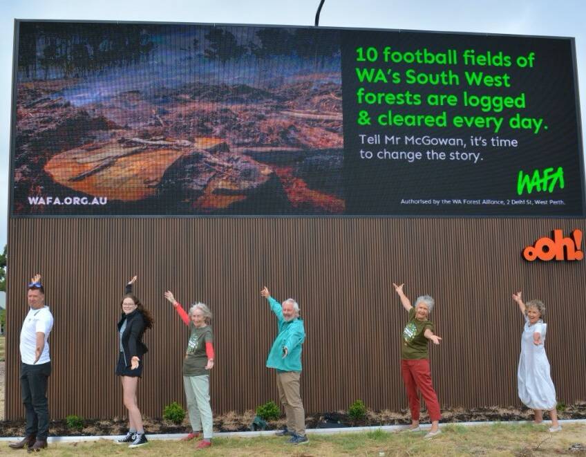 South West Environment Centre and WA Forest Alliance members at the Bunbury digital billboard. Photo is supplied.