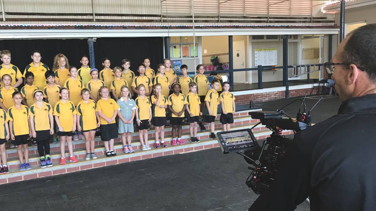 Bunbury Primary School choir in front of the cameras for the William Barrett and Sons Biggest Morning Tea event.