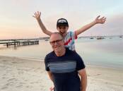 Recovery: Spencer Gummery is nearly nine years old and loving life, he is pictured with his dad, Scott.