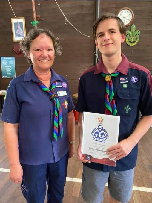 Scout leader Viv Campbell with Queens Scout award recipient Patrick Stephenson. Photo is supplied.